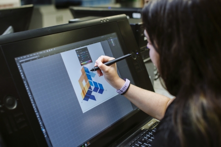 Female student drawing on Wacom tablet at University of Portsmouth