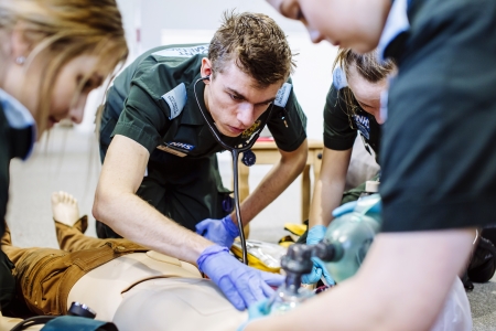Paramedic students practicing on a manikin