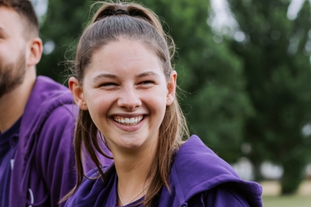 Female student ambassador stood outsideUp for Uni Day 1