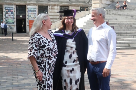 Nicole and her parents at Guildhall graduation ceremony