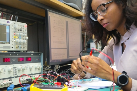 Savannah Pascall, an Electronic Engineering student using equipment