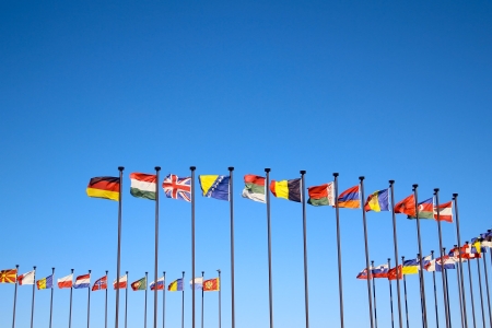 Flags of the world against blue sky