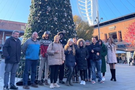 BSRO Team standing in front of a decorated christmas tree