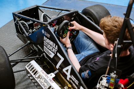 Student driving a single-seater racing car