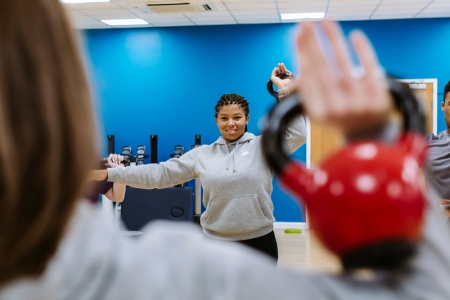 Students exercising with kettlebells in a University of Portsmouth gym