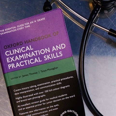 The cover of the Oxford Handbook Clinical Examination Practical Skills